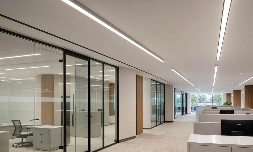 Linear LED lighting application with co extruded lens for commercial interiors